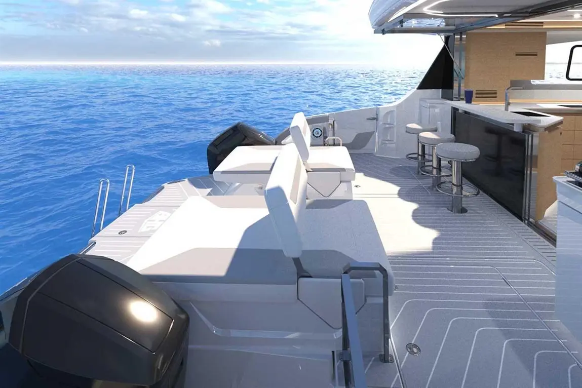 Luxury boat deck featuring two white chairs, a bar area, and calm blue waters under a bright sky.